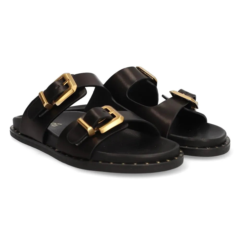Ladies black leather buckle sandals with gold-tone hardware, open-toe design, and adjustable straps.