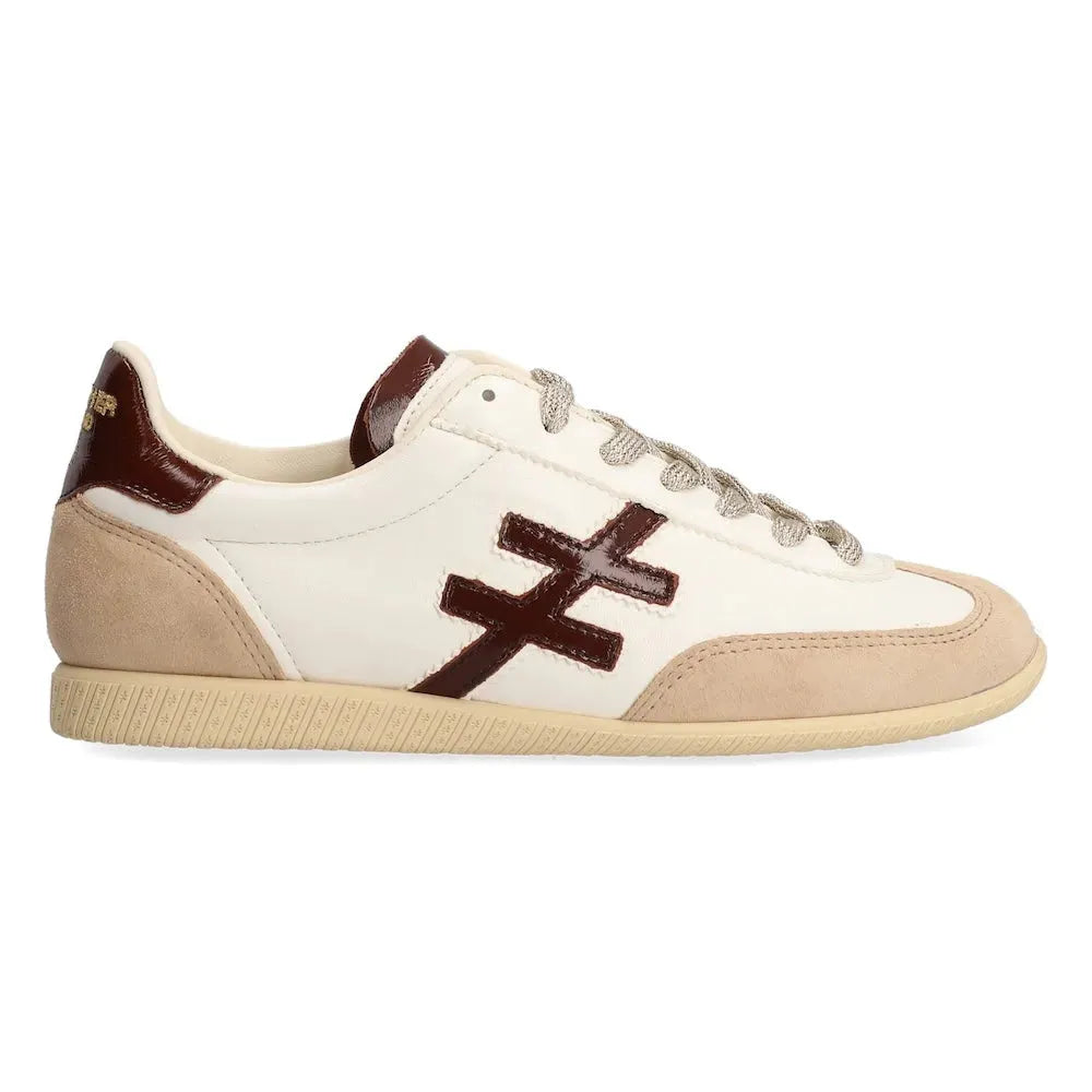 Ladies Spanish leather lace-up trainers with beige, white, and dark brown accents, stylish slip-on sneakers.