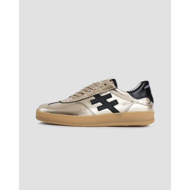 Metallic gold leather lace-up trainers with black cross detail, beige sole, and chunky design, style Iconic 2 58-43 Las Vegas.