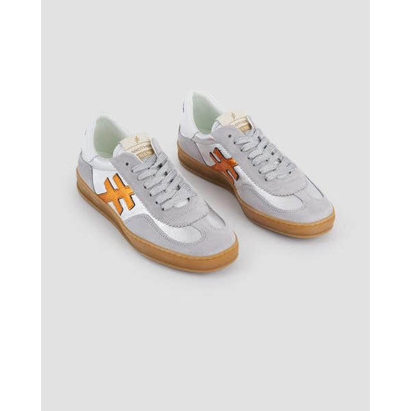 Women's Spanish Dove Grey Leather Lace-Up Trainers with orange side logo and gum sole.