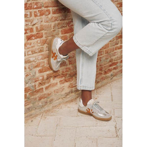 Spotless grey leather lace-up trainers for women with stylish design, casual comfort, and trendy detailing.