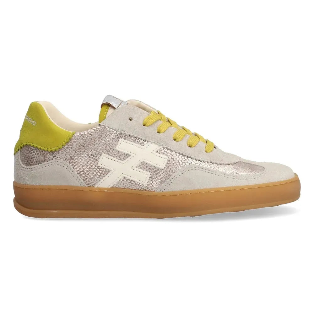 Ladies Spanish leather lace-up trainers with champagne color, mesh details, white logo, yellow accents, and gum sole.
