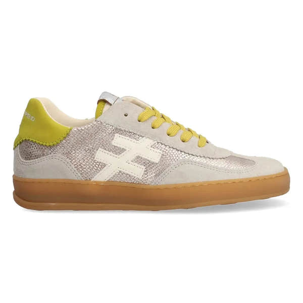 Ladies Spanish leather lace-up trainers with champagne color, mesh details, white logo, yellow accents, and gum sole.