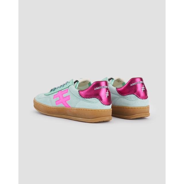 Men's Spanish Mint suede lace-up trainers with pink accents, chunky gum sole, stylish trend icon design.
