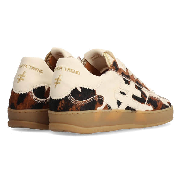 Women’s cow print leather lace-up trainers with chunky rubber soles, embroidered text, and contrasting stitching.