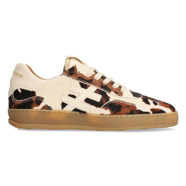 Women's cow print leather lace-up trainers with stylish animal pattern and comfortable rubber sole.