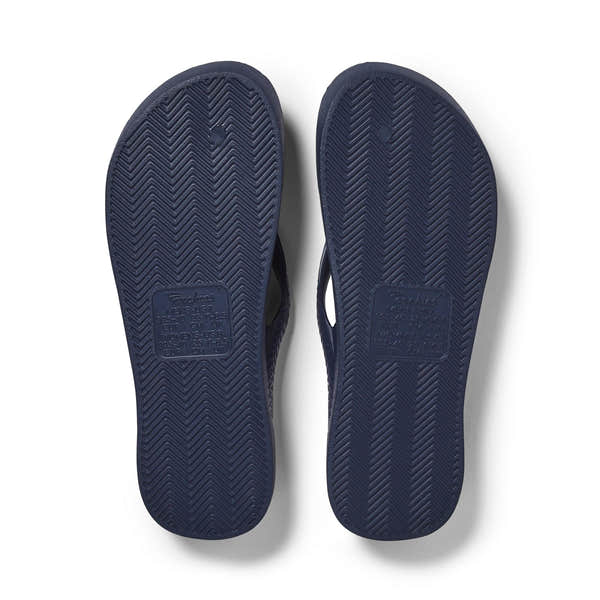Men's and women's navy waterproof slip-on sandals with arch support and textured rubber soles.