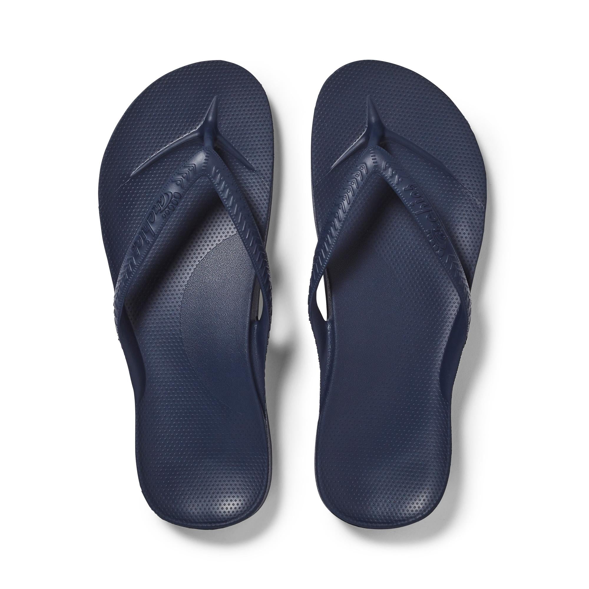 Unisex navy waterproof Archies Fit Flops slip-on sandals with arch support and textured footbed.