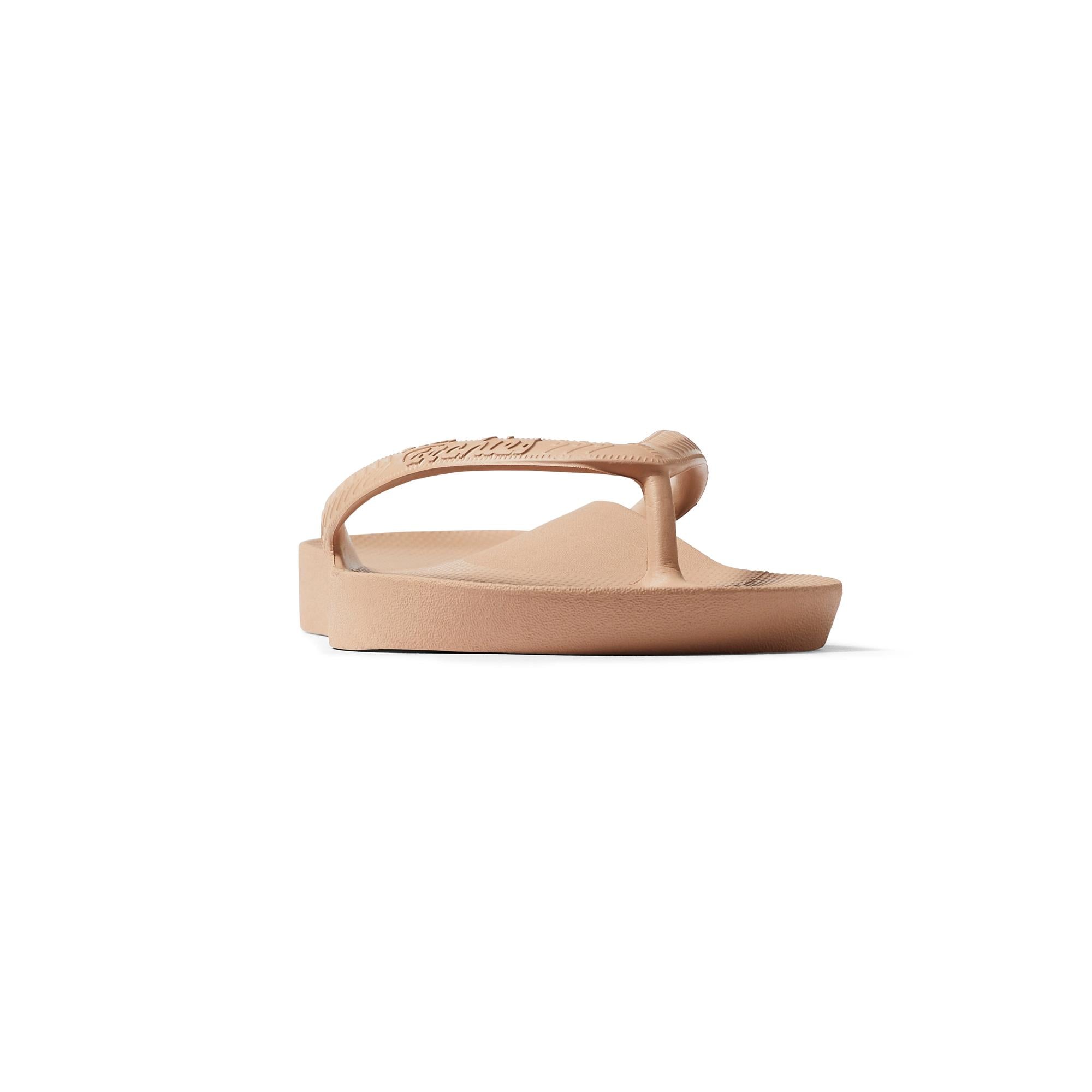 Unisex tan waterproof slip-on sandals with arch support, comfort fit, and classic design.