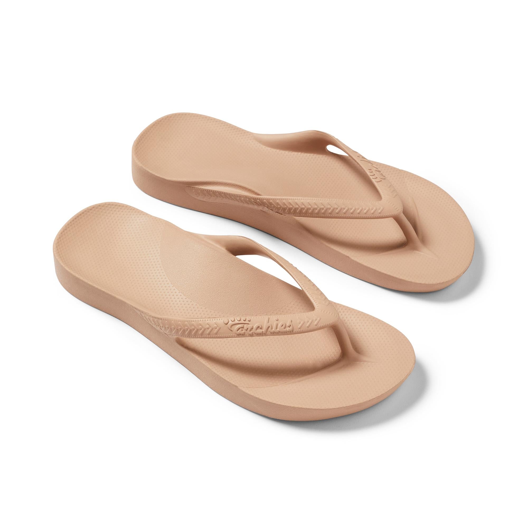 Unisex tan waterproof Archies Fit Flops slip-on sandals with arch support, cushioned footbed, and casual thong design.