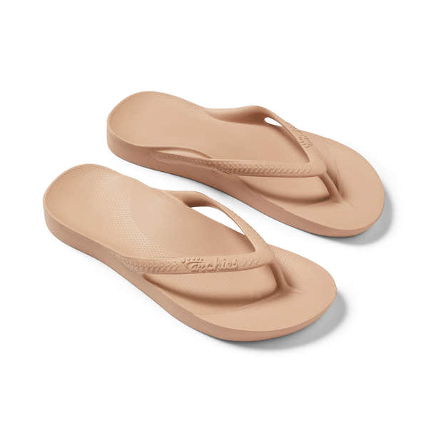 Unisex tan waterproof Archies Fit Flops slip-on sandals with arch support, cushioned footbed, and casual thong design.