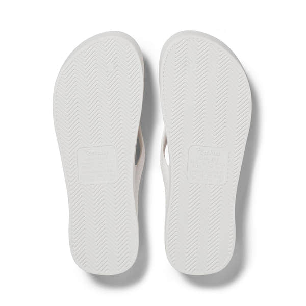 White waterproof unisex Archies Fit Flops classic slip-on sandals with arch support, ideal for casual wear.