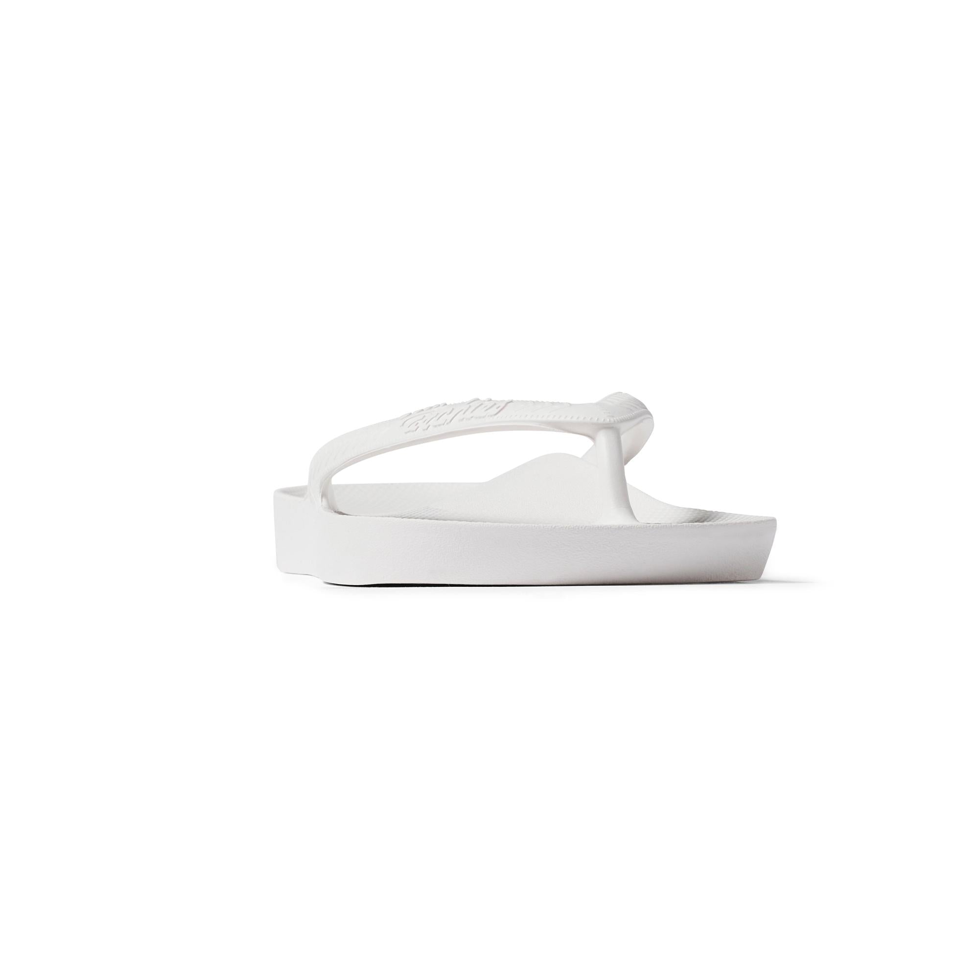 White waterproof Archies Fit Flops unisex slip-on sandals with arch support and casual design.