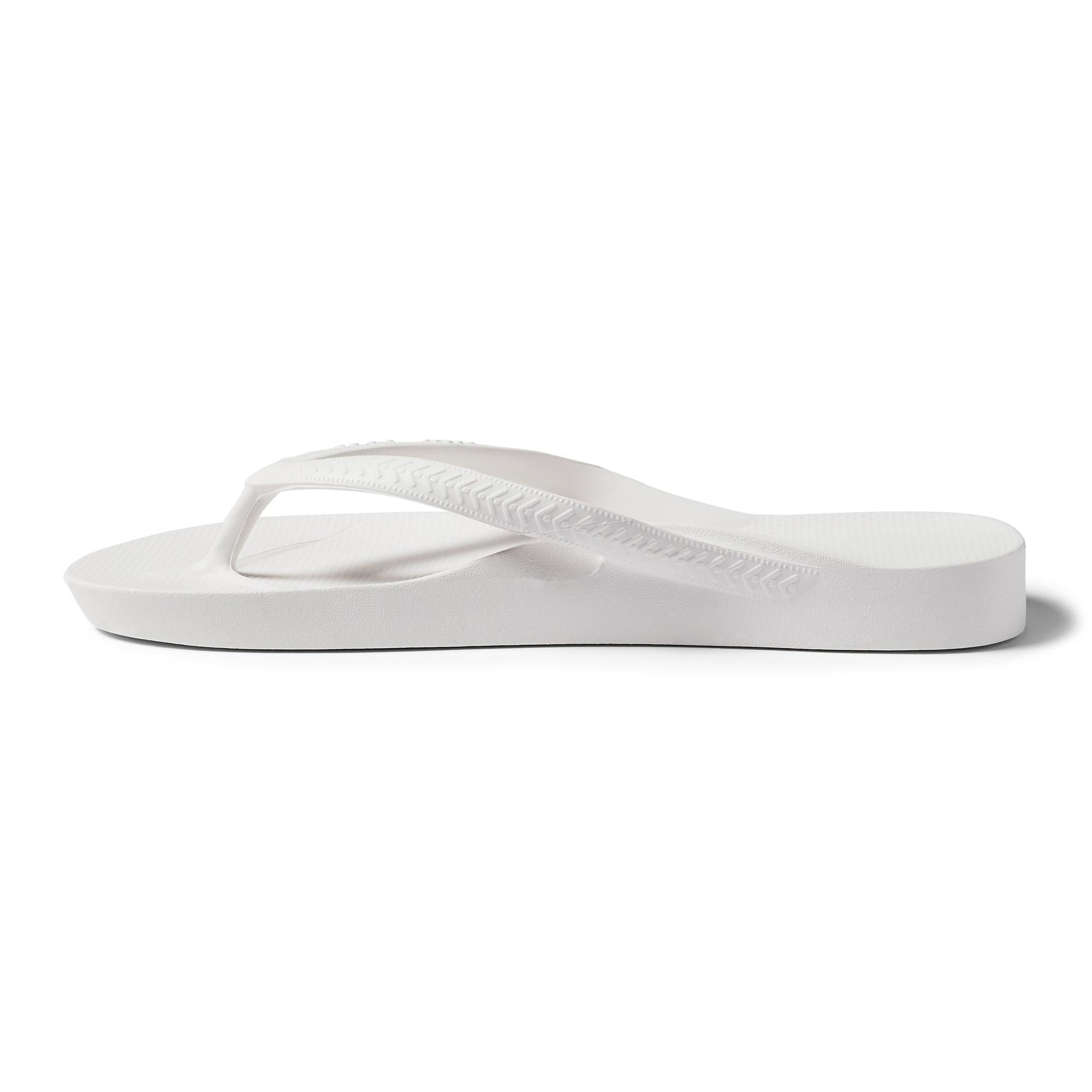 White waterproof unisex Archies Fit Flops classic slip-on sandals with arch support and rubber sole.