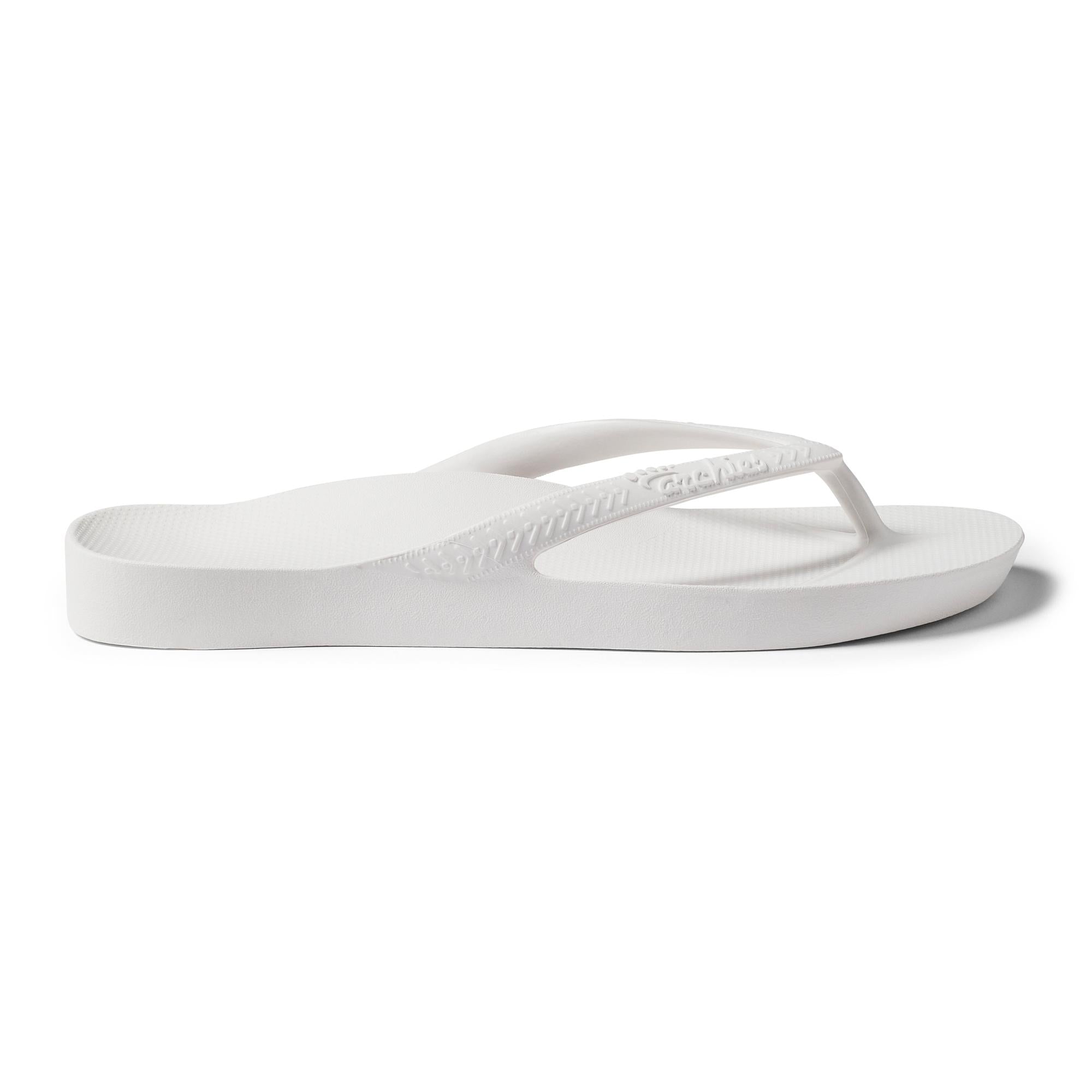 White waterproof Archies Fit Flops classic unisex slip-on sandals with arch support and lightweight design.