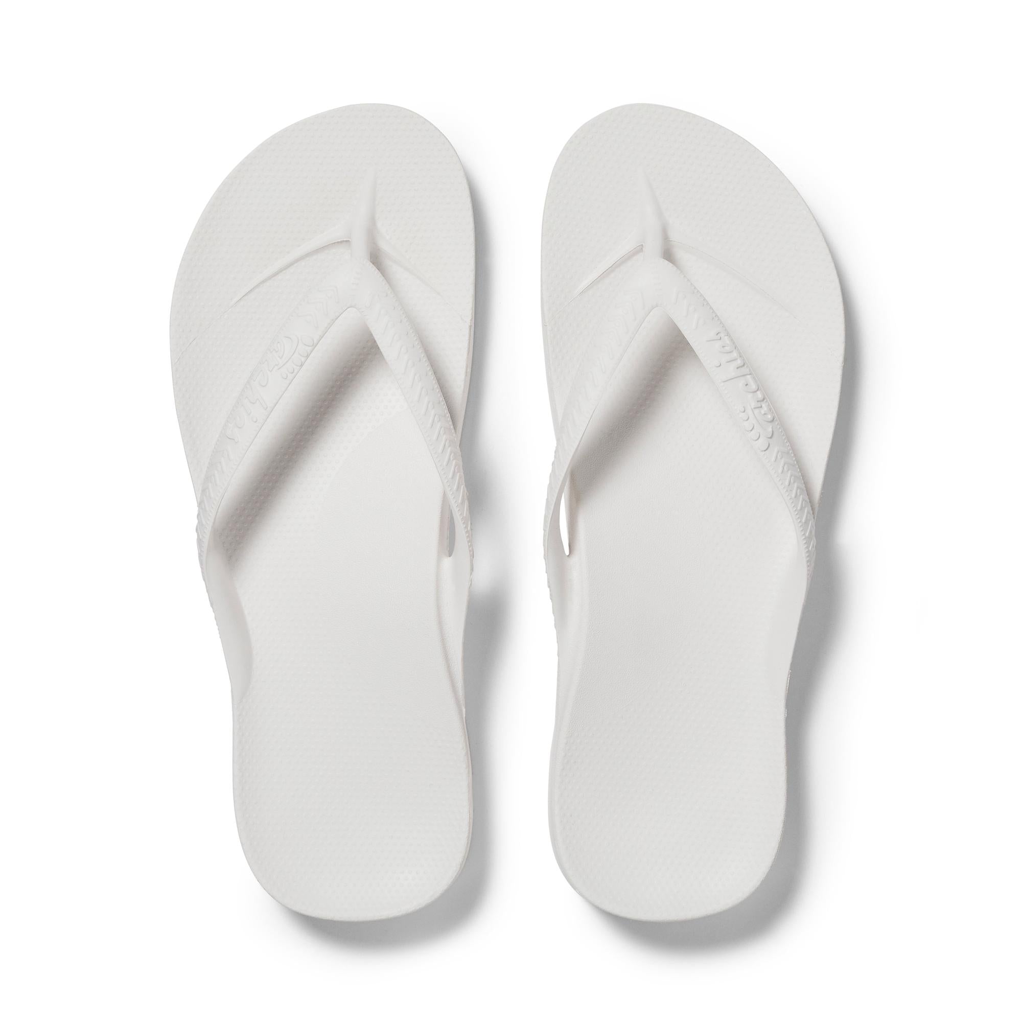 White waterproof unisex Archies Fit Flops slip-on sandals with arch support and comfort.