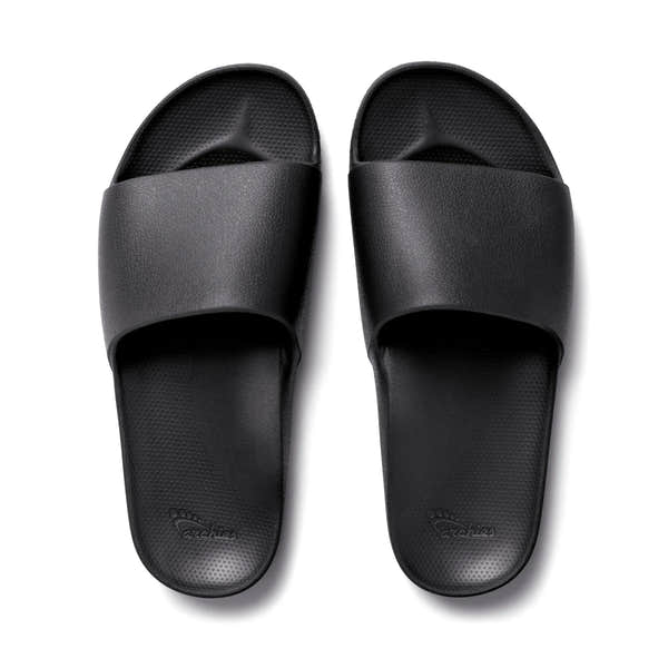 Black waterproof unisex arch support slides with textured footbed and wide strap, ideal for comfort and casual wear.