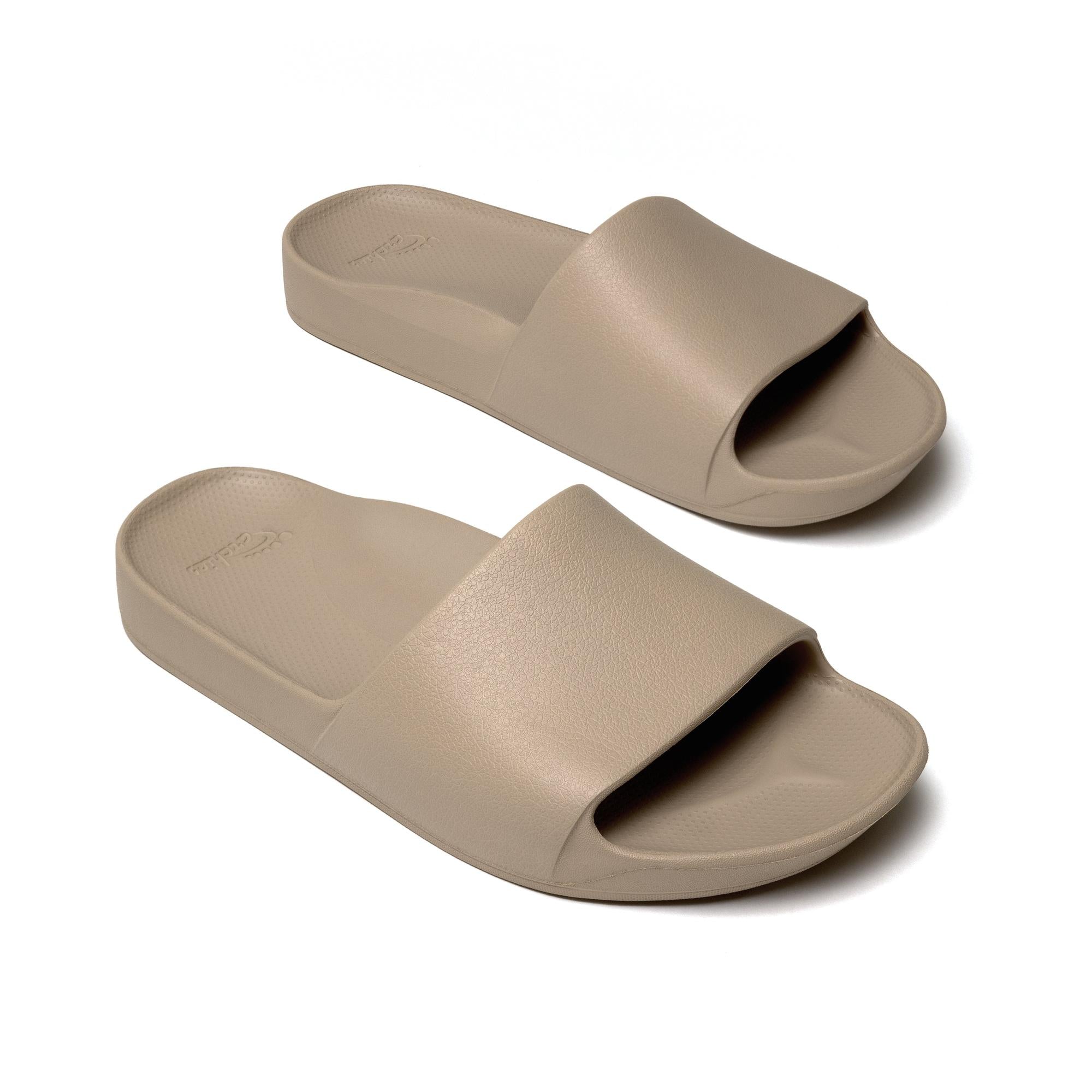 Unisex taupe waterproof Archies arch support slide sandals with wide strap and cushioned footbed.