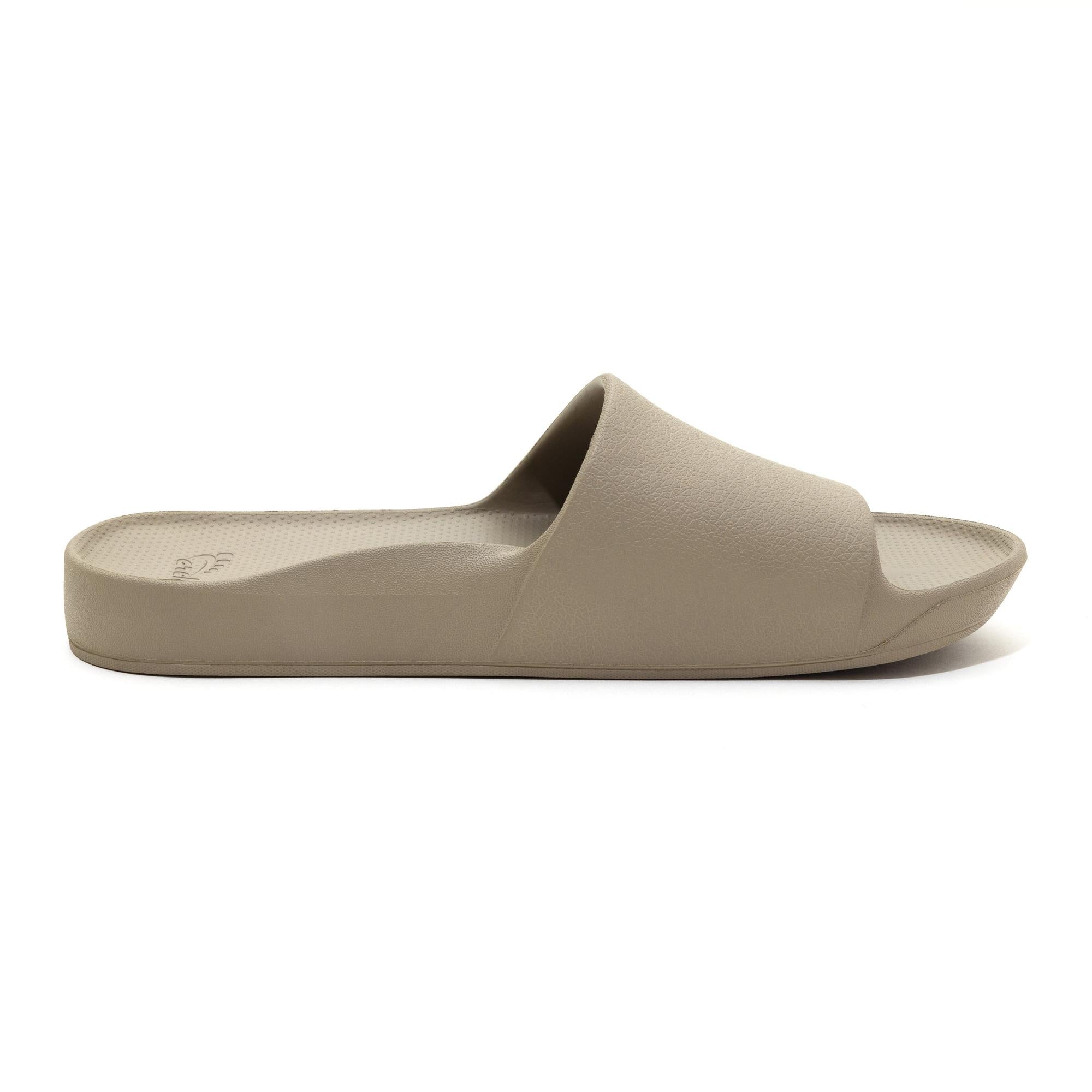 Unisex taupe waterproof Archies arch support slide sandal with cushioned footbed and open toe design.