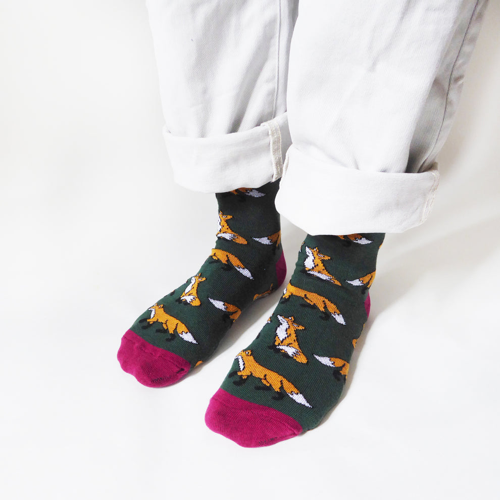 Barekind Save The Foxes bamboo socks with fox pattern, dark green, pink toes, eco-friendly footwear accessory.