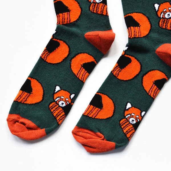 Barekind Save The Reds Pandas bamboo socks with orange and black panda and tiger pattern on dark green background.