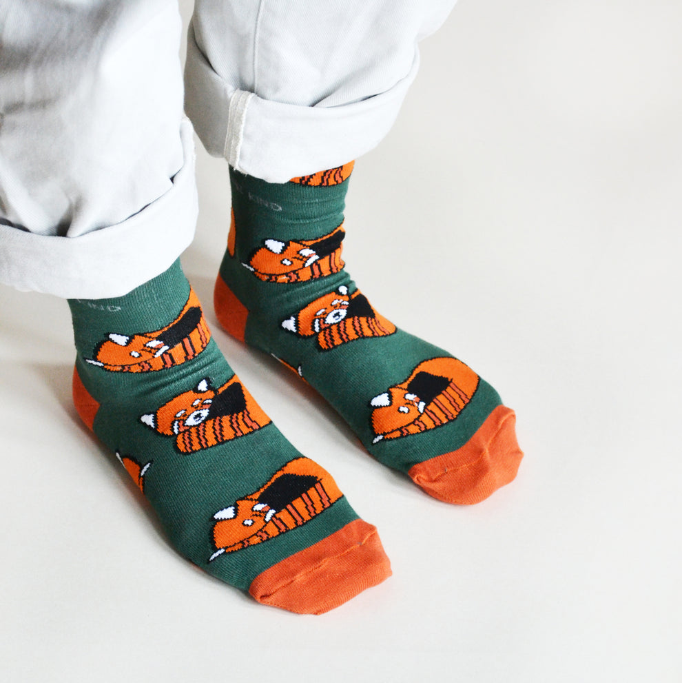 Barekind Save The Reds Pandas bamboo socks featuring cute orange fox graphic, green background, and orange toe accents.