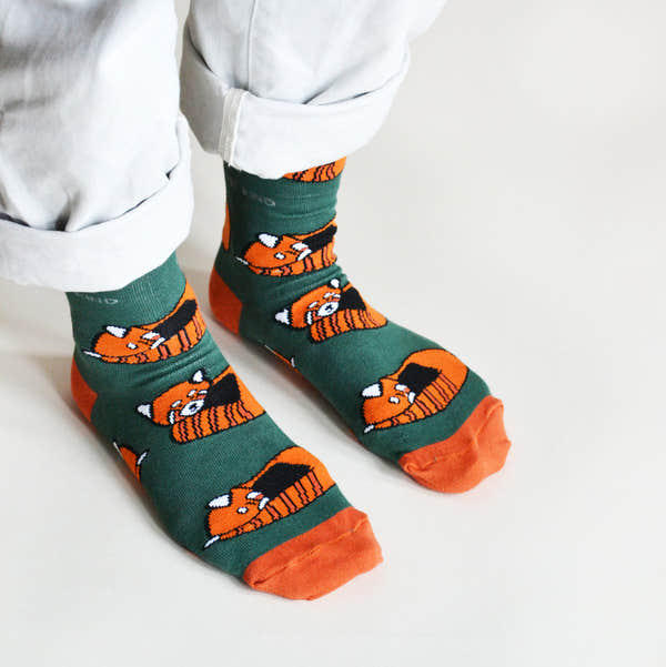 Barekind Save The Reds Pandas bamboo socks featuring cute orange fox graphic, green background, and orange toe accents.
