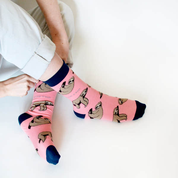 Barekind Save The Sloths bamboo socks with sloth print, pink color, navy accents, and eco-friendly design.
