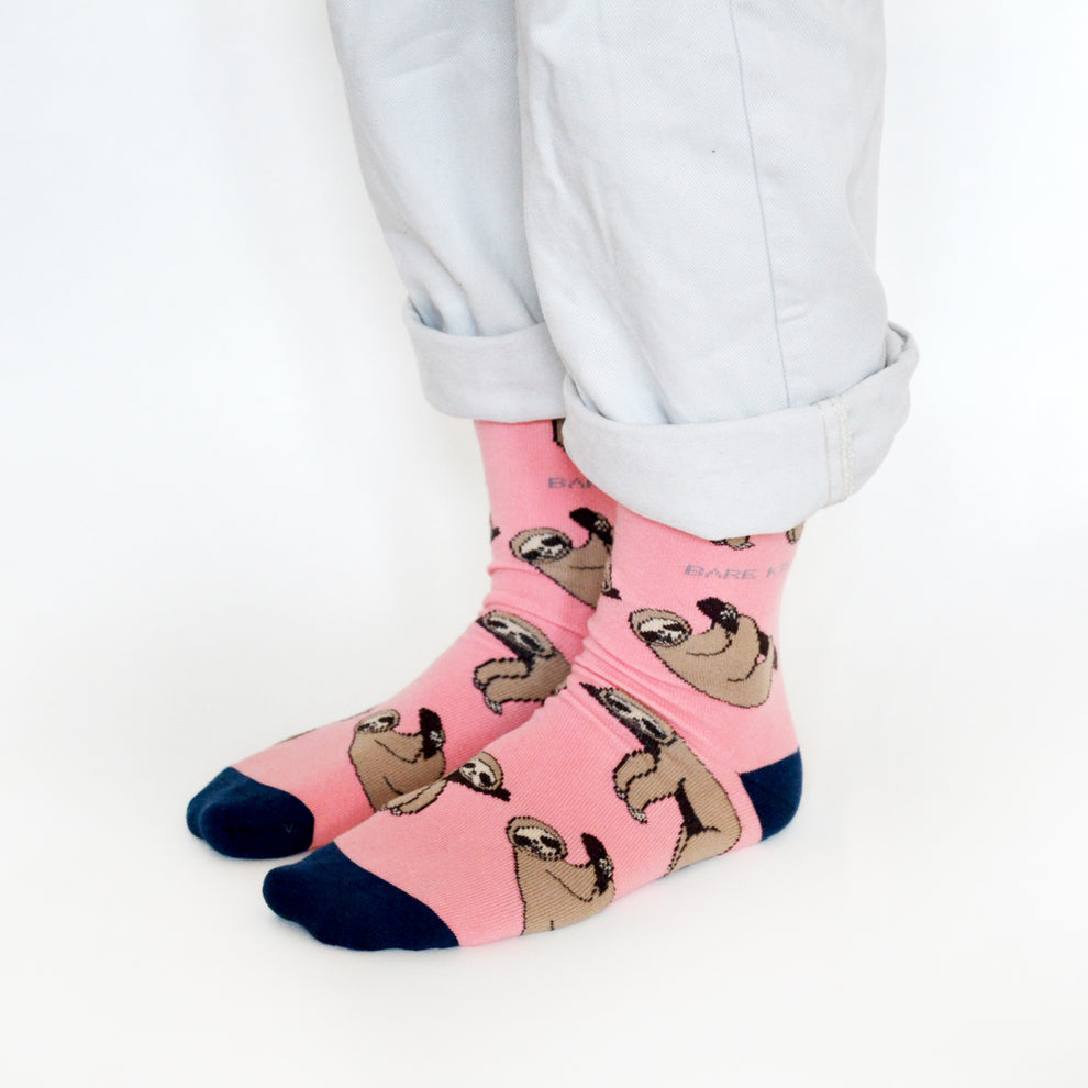 Barekind Save The Sloths bamboo socks with sloth prints, pink color, and navy toe and heel, eco-friendly and sustainable footwear.