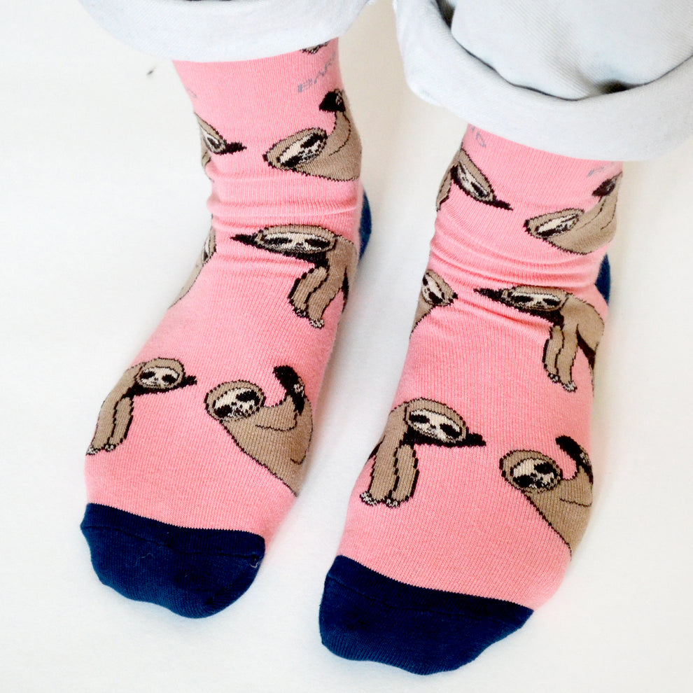 Pink bamboo socks with sloth print, Barekind Save The Sloths design, navy toes, fun and eco-friendly footwear.