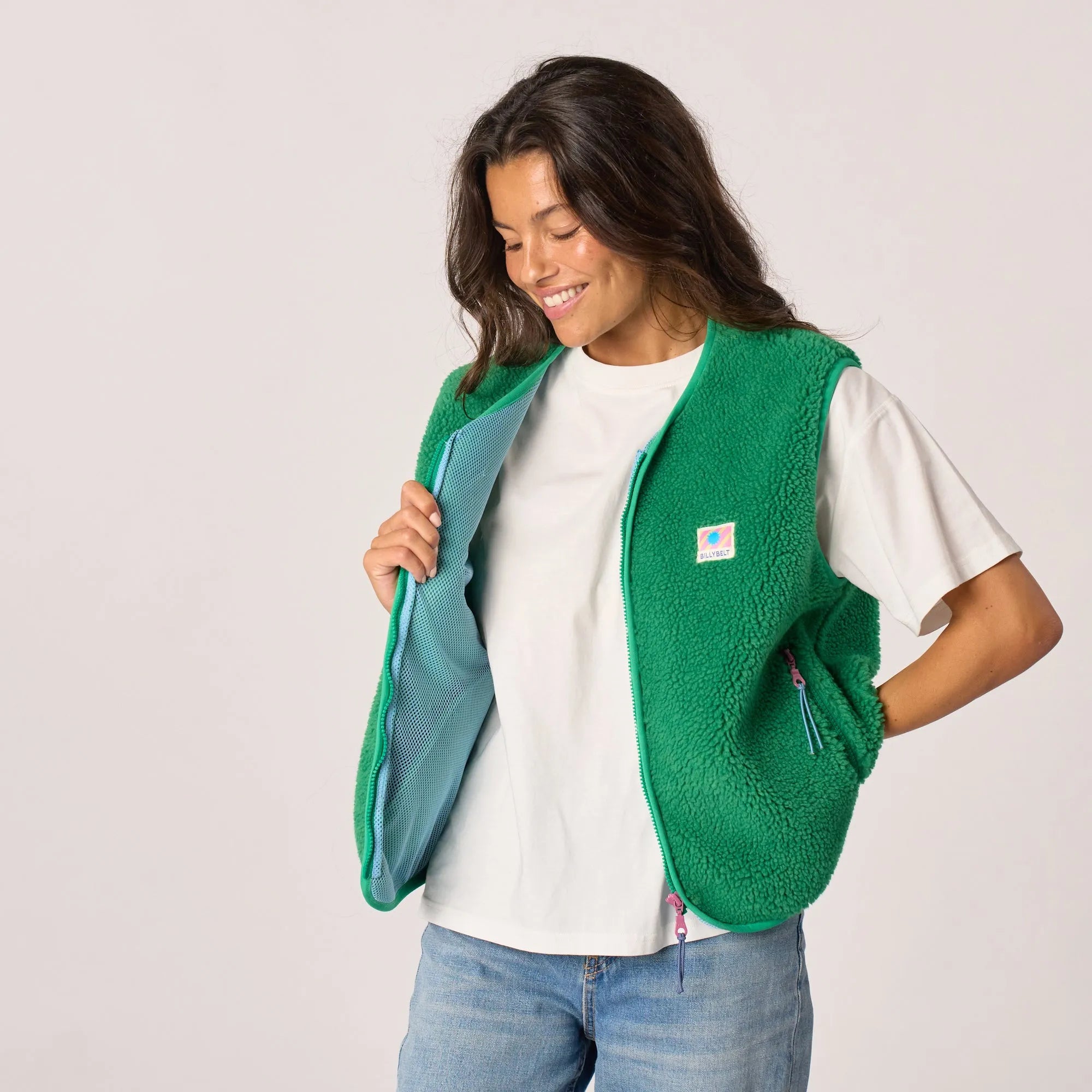 Billy Belt Ladies Sleeveless Green Sherpa Zip Jacket, cozy fleece vest with side pockets and colorful branding.