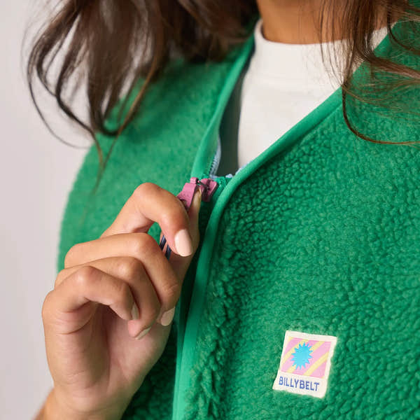 Billy Belt ladies sleeveless sherpa zip jacket in green, featuring a front zipper and logo patch, cheerful and cozy outdoor wear.