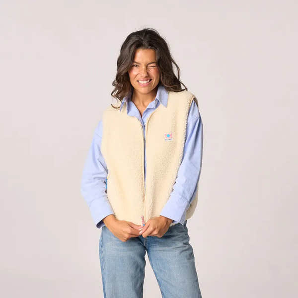 Billy Belt women's sleeveless ivory sherpa zip-up jacket, cozy and stylish outerwear for fall and winter.