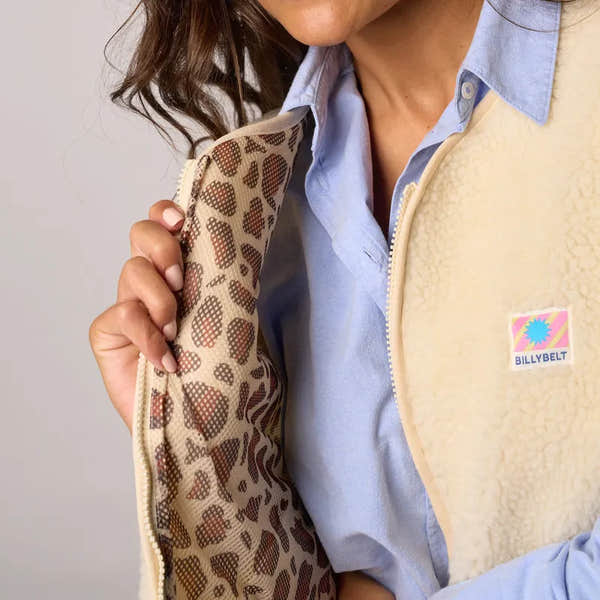 Billy Belt women's sleeveless ivory sherpa zip jacket with leopard-print lining, casual winter outerwear.