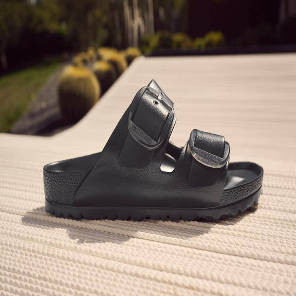 Black Birkenstock Arizona Big Buckle EVA narrow slide sandals with arch support and buckle detail.