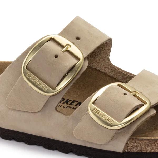 Birkenstock Arizona women's narrow nubuck sandals with large gold buckle, arch support, and adjustable straps.