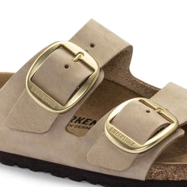 Birkenstock Arizona women's narrow nubuck sandals with large gold buckle, arch support, and adjustable straps.