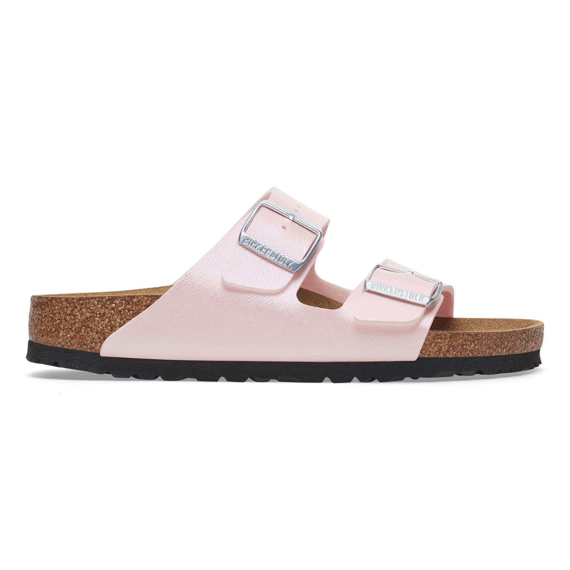 Birkenstock Arizona Birkoflor women's narrow sandals with iridescent light pink upper, arch support, buckle straps, cork sole, and black outsole.