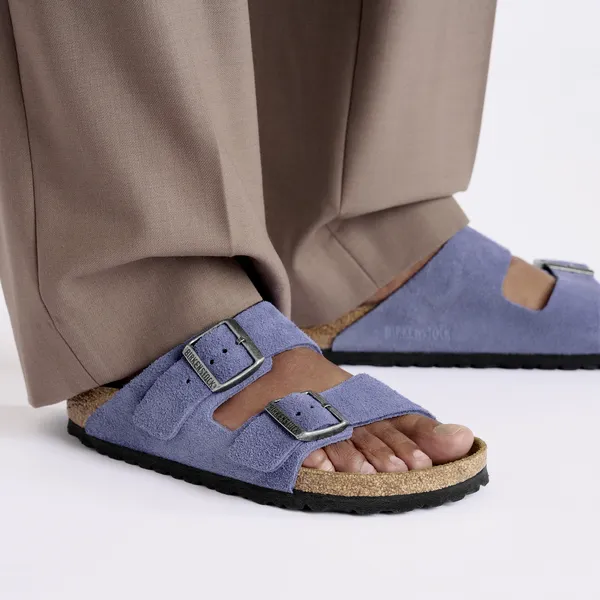 Birkenstock Arizona women's narrow purple dusk suede sandals with arch support and buckle straps.