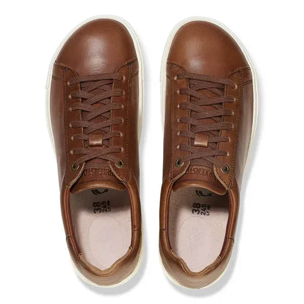 Unisex Cognac Leather Birkenstock Bend Low 1026177 sneakers with arch support, lace-up design, and white rubber soles.