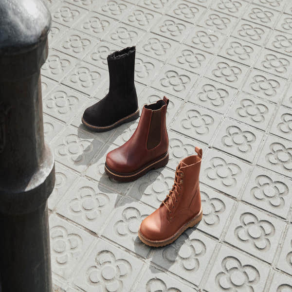 Birkenstock Bryson 1030103 women's cognac leather lace-up ankle boots with arch support and rugged sole.