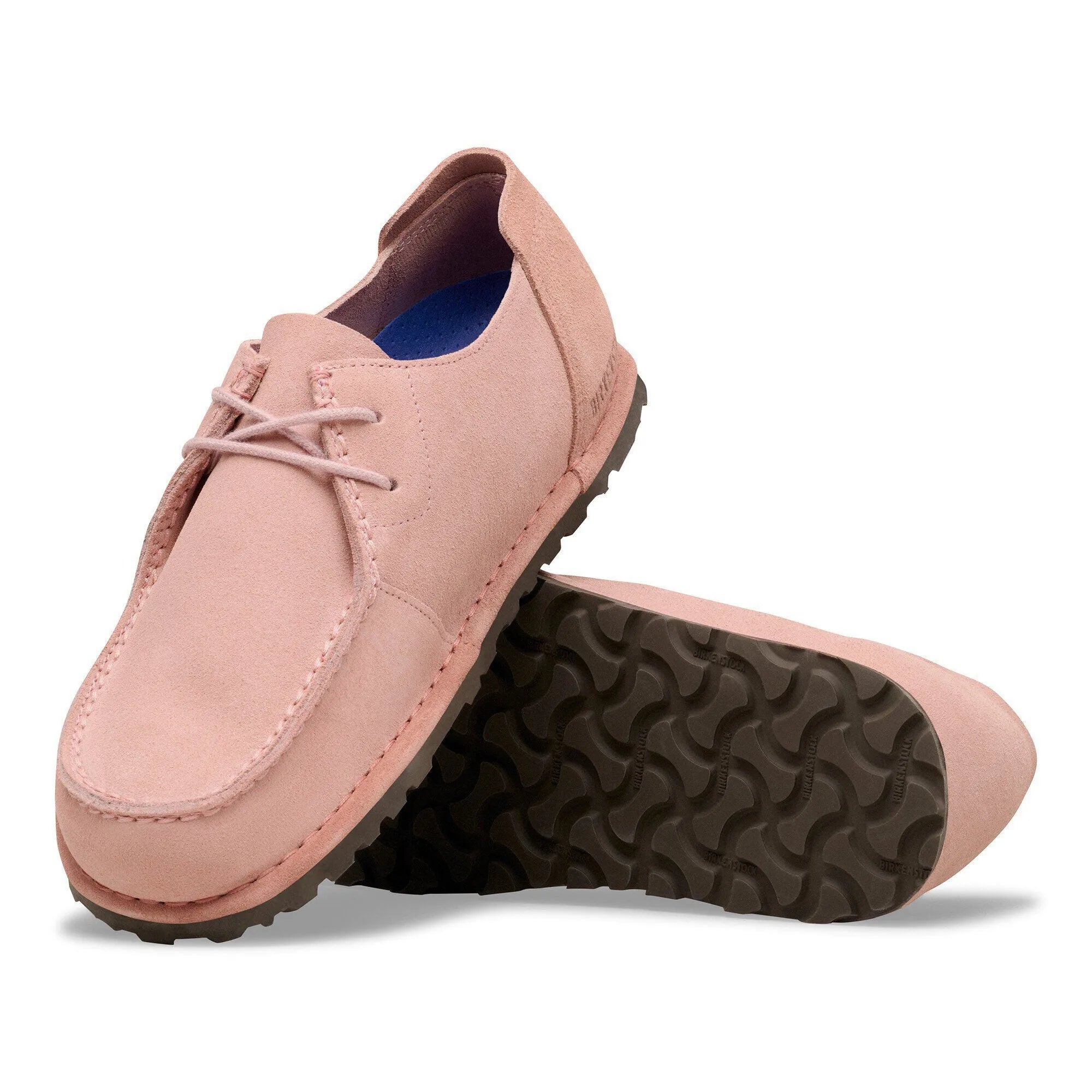 Unisex pink suede Birkenstock Utti Lace shoes with arch support and lace-up design, featuring black textured sole.