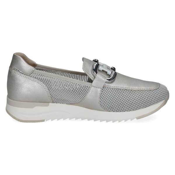 Ladies silver slip-on shoes with leather, textile, and perforated details, silver buckle, and white sole.