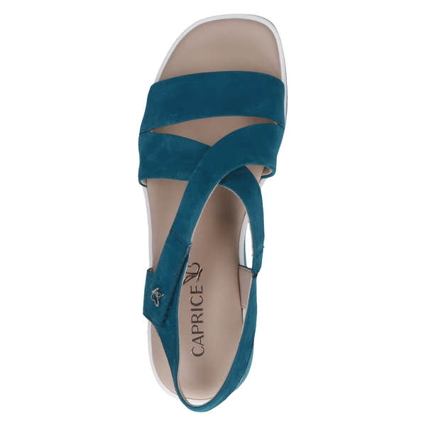 Blue leather touch fastening sandals for women with crisscross straps and cushioned footbed.