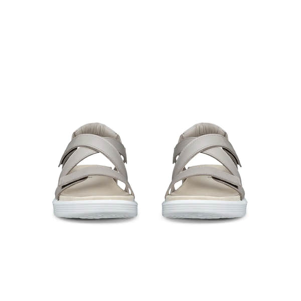 Pair of beige sandals on a white background