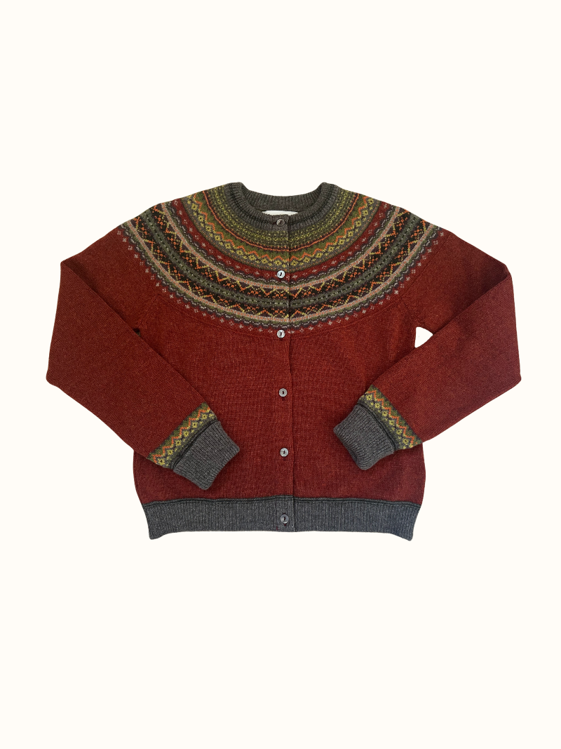 Eribe Alpine Short Cardigan in Copperleaf, Nordic-inspired pattern, red and green tones, ribbed cuffs and hem, button closure.