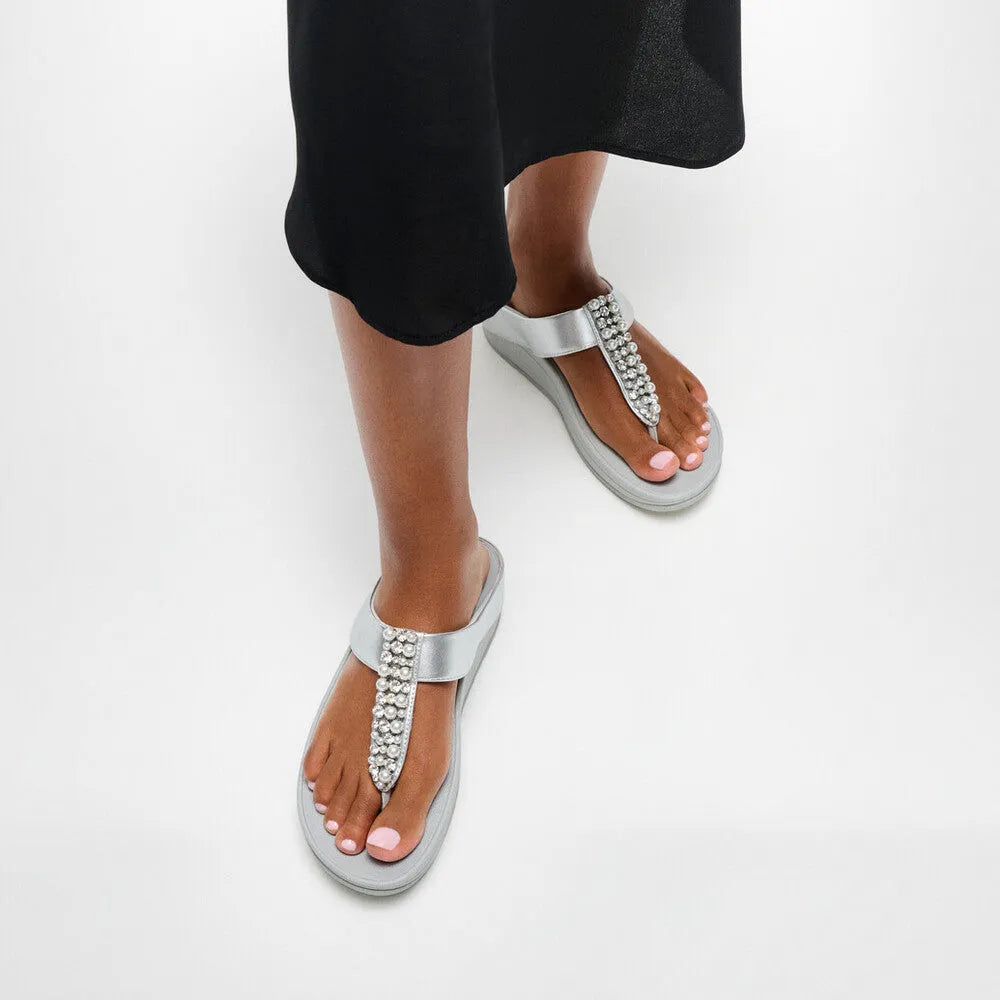 FitFlop Fino Pearls Silver T-Bar Ladies Sandals with pearl embellishments, flat sole, and silver strap.