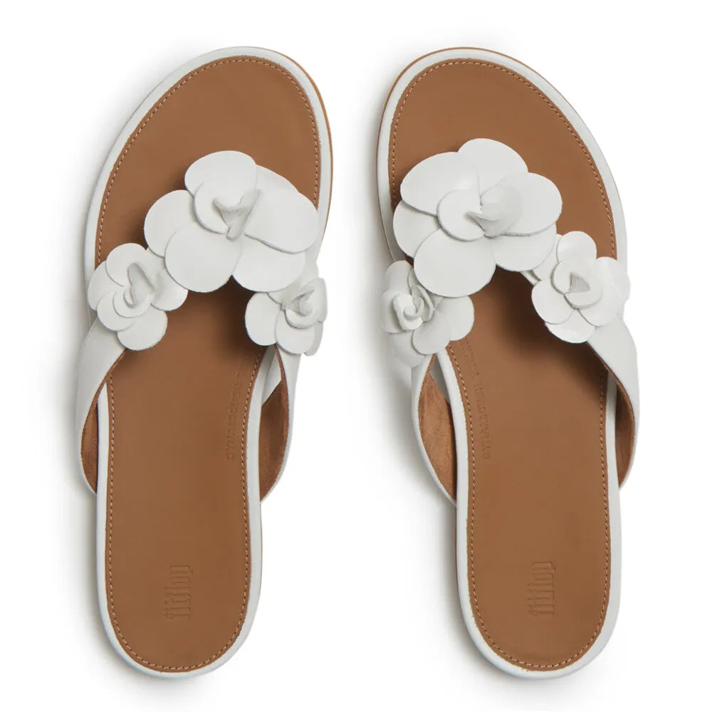 FitFlop A4A-194 Gracie Flower women's white leather T-strap sandals with floral embellishments, cushioned sole, and open toe.