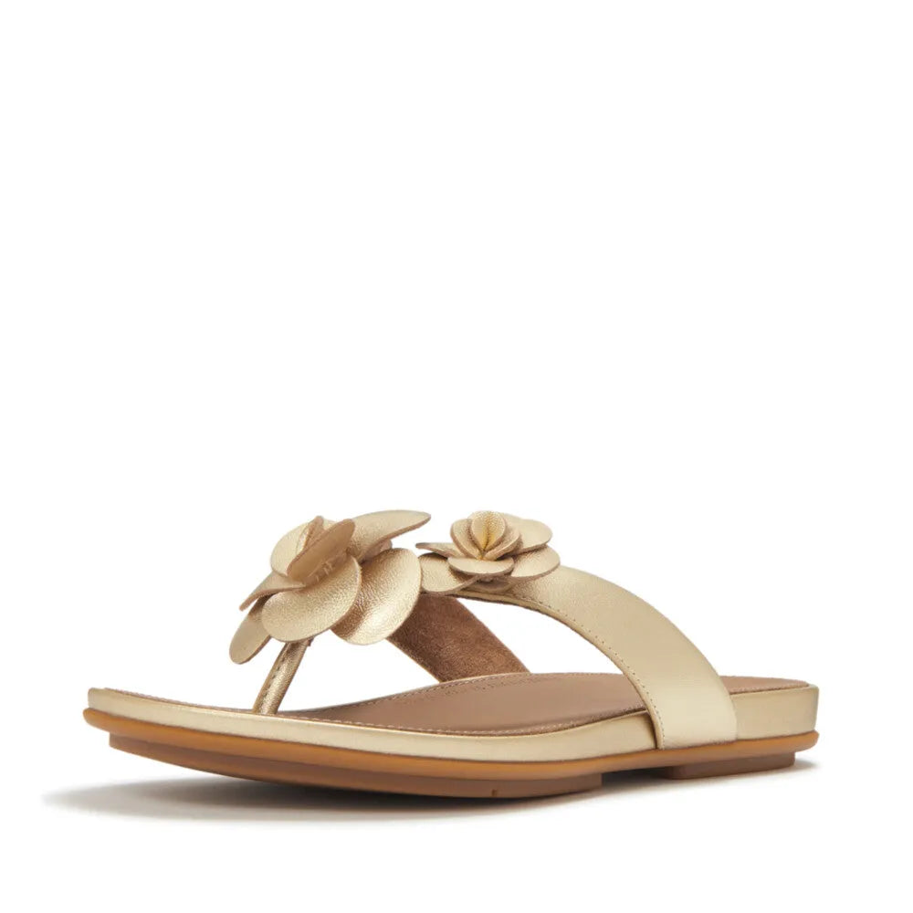 FitFlop A4A-675 Gracie Flower women's platinum leather T-strap sandals with floral embellishments and cushioned footbed.