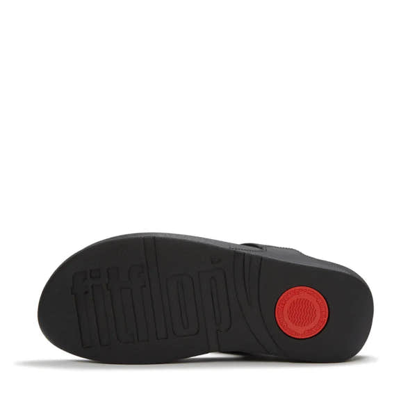 FitFlop Lulu marbled stone black T-strap sandals with cushioned sole and red logo detail, women’s fashionable flat footwear.